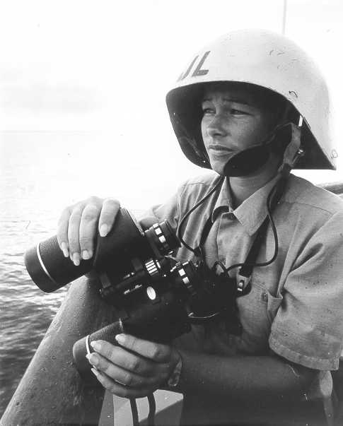 A femal Coast Guardsman on board a cutter. A femal Coast Guardsman on board a cutter.